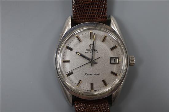 A gentlemans stainless steel Omega Seamaster automatic wrist watch, on associated lizard strap.